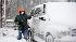 Gary Gardner of Chesapeake Beach, Md., cleans...