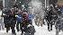 A group takes part in an impromptu snowball...