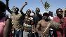 Earthquake survivors chant during a demonstration in Port-au-Prince, Wednesday, Feb. 3, 2010.