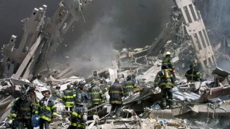 ** FILE ** Firefighters make their way through the rubble after two airliners crashed into the World Trade Center in New York bringing down the landmark buildings Tuesday, Sept. 11, 2001.