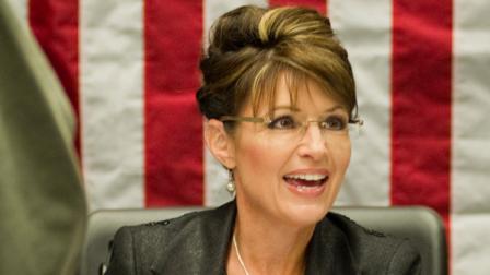 FILE - In a Nov. 30, 2010 file photo, Sarah Palin signs copies of her new book, America By Heart, in Little Rock, Ark.