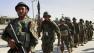 Afghans rioted for a second day Saturday to protest the burning of a Quran in Florida, killing nine people in Kandahar.