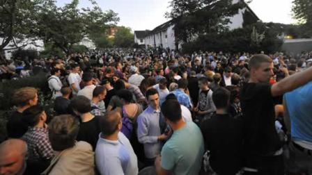 Party goers gather in Hamburg, Germany, Friday, June 3, 2011, after a teenage girl, identified only as Thessa, forgot to mark her birthday invitation as private on Facebook. The teenager ran away from her own party when more than 1,500 guests showed up and around 100 police officers with horses had to keep the party crowd under control. (AP Photo/dapd, Stefan Simonsen)