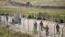Israeli troops patrol along the border between Israel and Syria near the village of Majdal Shams in the Golan Heights early Monday, June 6, 2011.