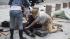 A victim is treated outside government buildings...