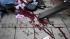 Blood smears the pavement, as a victim is...