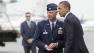 President Barack Obama is greeted by Col. Mark Camerer, the 436th Airlift Wing Commander upon his arrival at Dover Air Force Base, Del., Tuesday, Aug. 9, 2011.