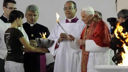 Benedict XVI lights a candle during an evening vigil in Freiburg, Germany, Saturday, Sept. 24, 2011. Pope Benedict XVI is on a four-day official visit to his homeland Germany. (AP Photo/Martin Meissner)