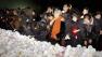 People lay flowers to pay respects to late North Korean leader Kim Jong Il