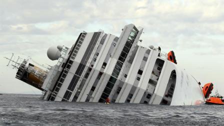 The luxury cruise ship Costa Concordia lies on its side after it ran aground off the tiny Tuscan island of Giglio, Italy, Sunday, Jan. 15, 2012.