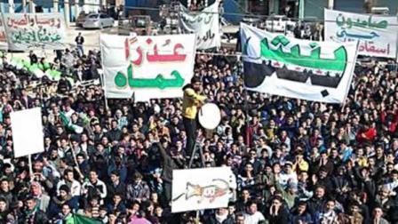 In this citizen journalism image provided by the Local Coordination Committees in Syria and released Friday, Feb. 3, 2012, anti-Syrian regime protesters march in Bensh, Idlib Province, northern Syria.