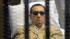 Egypts ex-President Hosni Mubarak lays on a gurney inside a barred cage in the police academy courthouse in Cairo, Egypt, Saturday, June 2, 2012. Mubarak was sentenced to life in prison Saturday for his role in the killing of protesters during last years revolution that forced him from power, a verdict that caps a stunning fall from grace for a man who ruled the country as his personal fiefdom for nearly three decades.(AP Photo)