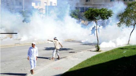 Demonstrators protest outside the US embassy , unseen, in Tunis, Friday, Sept.14, 2012.
