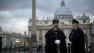 Police officers are seen outside St. Peters Square, at the Vatican.