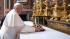Pope Francis holds mass and pays hotel bill :: In this photo provided by the Vatican newspaper LOsservatore Romano, Pope Francis puts flowers on the altar inside St. Mary Major Basilica, in Rome, Thursday, March 14, 2013.