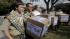 File photo James Oliver, left, hugs his brother and fellow Eagle Scout, Will Oliver, who is gay, as Will and other supporters carry four boxes filled with a petition in front of the Boy Scouts of America headquarters, in Dallas, Texas