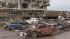 The Moore Medical Center and vehicles lay damaged after a tornado moves through Moore, Okla. on Monday, May 20, 2013.