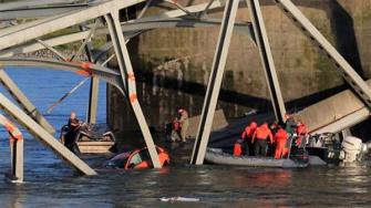 In this photo provided by Francisco Rodriguez, rescue boats approach victims at their vehicles in the Skagit River after the collapse of the Interstate 5 bridge there minutes earlier Thursday, May 23, 2013, in Mount Vernon, Wash.