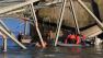 In this photo provided by Francisco Rodriguez, rescue boats approach victims at their vehicles in the Skagit River after the collapse of the Interstate 5 bridge there minutes earlier Thursday, May 23, 2013, in Mount Vernon, Wash.