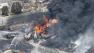 Smoke rises from railway cars that were carrying crude oil after derailing in downtown Lac Megantic, Quebec, Canada.