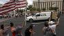 A procession of 19 hearses drives through Phoenix, Sunday, July 7, 2013