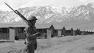 This May 23, 1943 file photo shows an American soldier guarding a Japanese internment camp at Tule Lake, Calif. (AP Photo, File)