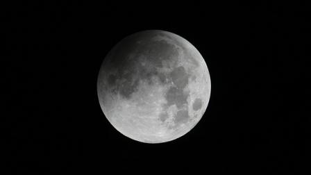 The moon is seen as the Earth casts its shadow in a total lunar eclipse as seen in Manila, Philippines, before dawn Thursday June 16, 2011.