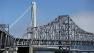 The self-anchored suspension of the new eastern section of the San Francisco-Oakland Bay Bridge is seen behind the current eastern section which is closed to traffic in San Francisco, Thursday, Aug. 29, 2013.