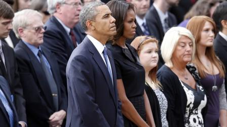 President Barack Obama and first lady Michelle Obama attend a memorial service for the victims of the Washington Navy Yard shooting