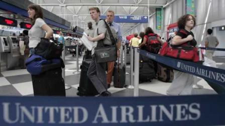 Passengers wait to check in for their United Airline flights at Chicagos OHare International Airport Wednesday, June 22, 2005. United announced an immediate 3 percent fare increase on most of their domestic and international flights, citing the rising cost of oil as the reason. (AP Photo/Charles Rex Arbogast)