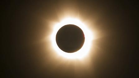 In this photo provided by Tourism Queensland, the moment of a total solar eclipse is observed at Cape Tribulation in Queensland state, Australia, Wednesday, Nov. 14, 2012.