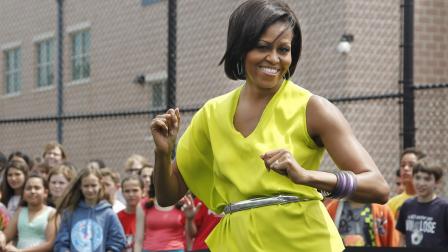 First lady Michelle Obama dances with students at Alice Deal Middle School in northwest Washington, Tuesday, May 3, 2011, during a surprise visit for the schools Lets Move! event. (AP Photo/Manuel Balce Ceneta)