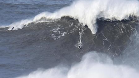 US surfer Garret McNamara rides a giant wave at Praia do Norte, north beach, in Nazare, in Portugals Atlantic coast Sunday, Feb. 2 2014