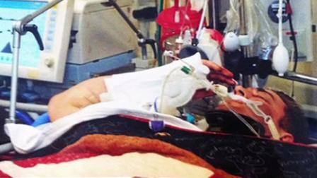 A wounded Josh Hargis saluting his commanding officer from his hospital bed.