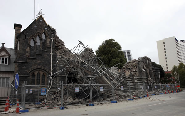 A building in Christchurch, New Zealand, is destroyed after an earthquake struck Tuesday, Feb. 22, 2011. The 6.3-magnitude quake collapsed buildings and is sending rescuers scrambling to help trapped people amid reports of multiple deaths.