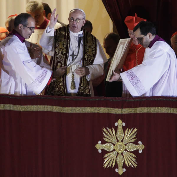 Pope Francis blesses the crowd from the central...