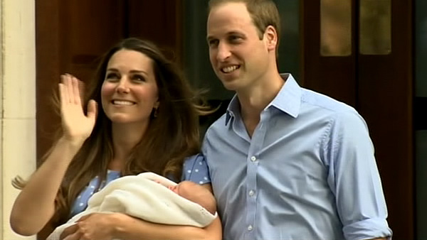 A beaming Prince William and his wife, Kate,...