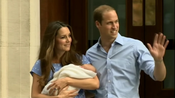 A beaming Prince William and his wife, Kate,...