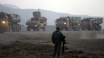  U.S. Army soldier watches as a convoy