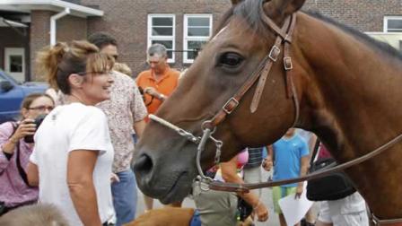 Former Alaska Gov. Sarah Palin visits at the Iowa State Fair in Des Moines, Iowa, Friday, Aug. 12, 2011. (AP Photo/Charles Dharapak)