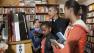 President Barack Obama visits Kramerbooks for shopping with his daughters Sasha, third from right, and Malia, right, Saturday, Nov. 26, 2011, in Washington. (AP Photo/Carolyn Kaster)
