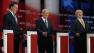 Mitt Romney, Ron Paul and Newt Gingrich laugh a the conclusion of a Republican presidential candidate debate.