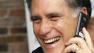 Republican presidential candidate, former Massachusetts Gov. Mitt Romney laughs as he speaks with a voter at his campaign office in Tampa, Fla., Tuesday, Jan. 31, 2012, during Floridas primary election day. (AP Photo/Charles Dharapak)