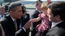 President Barack Obama greets the crowd after arriving at San Francisco International Airport in San Francisco, Thursday, Feb. 16, 2012. (AP Photo/Susan Walsh)