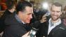 Republican presidential candidate, former Massachusetts Gov. Mitt Romney greets supporters who braved the rain during a campaign stop at the Whistle Stop Cafe, Monday, March 12, 2012 in Mobile, Ala.