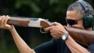 President Obama firing rifle