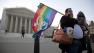 Marcos German Domingues of Massachusetts stands with his dogs Sophia, left, and Georg, right, in front of the Supreme Court in Washington, Wednesday, March 27, 2013. (AP Photo/Carolyn Kaster)
