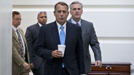 Speaker of the House John Boehner, R-Ohio, with House Majority Whip Kevin McCarthy, R-Calif., right, walks to a meeting of House Republicans at the Capitol in Washington, Tuesday, Oct. 15, 2013, as a partial government shutdown enters its third week. It is not yet clear how Boehner and tea party members in the House majority will respond to the Senates Democratic and Republican leaders closing in on a deal to avoid an economy-menacing Treasury default and end the partial government shutdown. (AP Photo/J. Scott Applewhite)