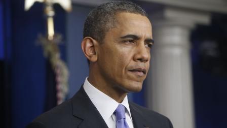 President Barack Obama listens to a question during his end-of-the-year news conference in the Brady Press Room at the White House in Washington, Friday, Dec. 20, 2013.