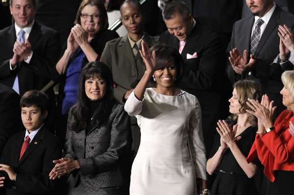 First lady Michelle Obama waves on Capitol Hill...